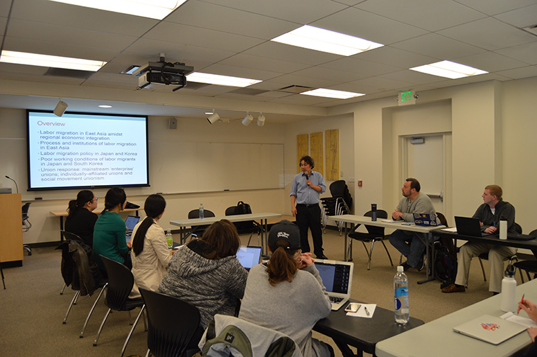 Dr. Watanabe presenting students with a case study during a workshop