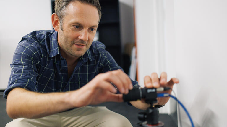 Professor Gerwyn Hughes adjusts camera