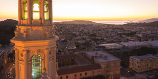 St Ignatius Church tower and sunset over the coast.