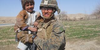 David Pham and an Afghan child