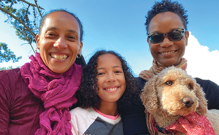 Chinyere Oparah, Onyeka Oparah, Shawn Nealy-Oparah, and Chizara, the mini labradoodle.