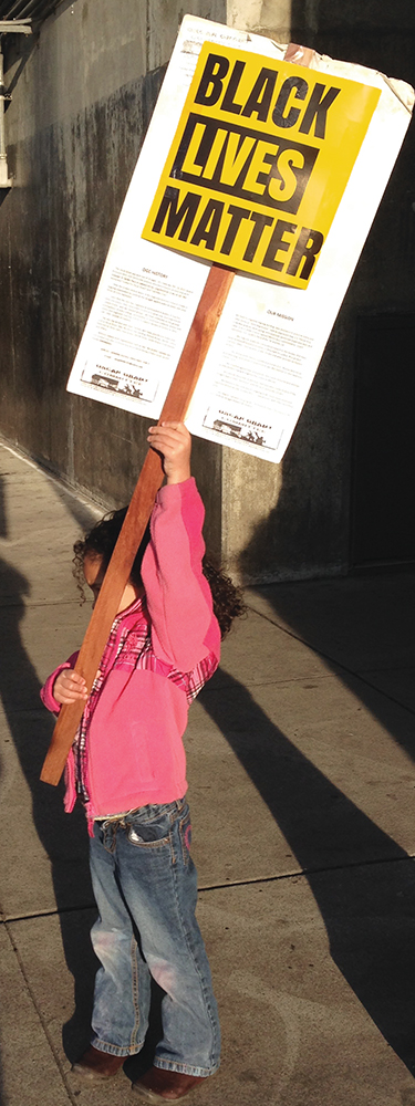 The provost's daughter, Onyeka Oparah, at a demonstration in Oakland circa 2016