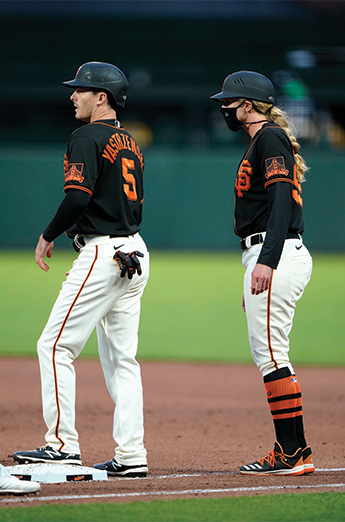 Alyssa Nakken working with a Giant's baseball player