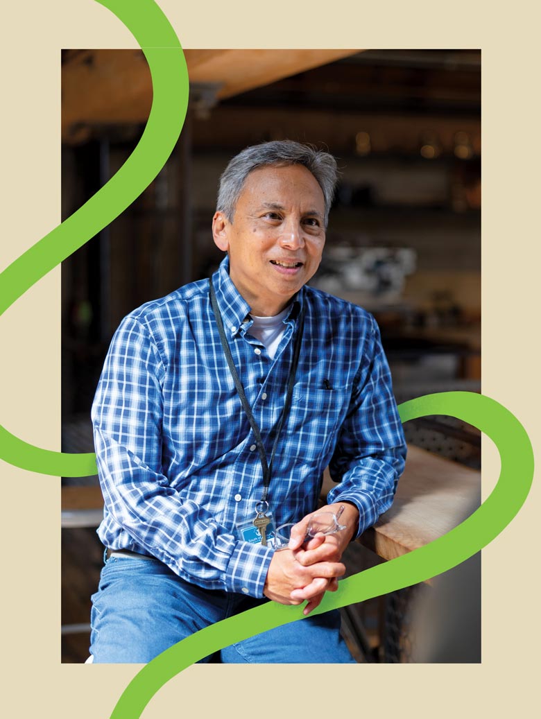 Sonny Manuel sitting in a cafe with a green line surrounding him