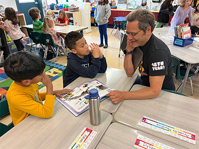 Willie Ablao MA ’05 studies Doggy Data with his students