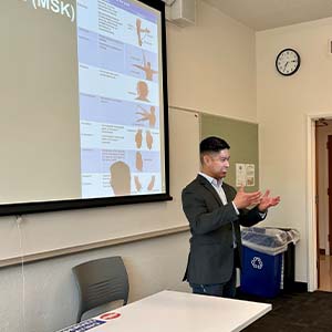Eugene Mamaril teaching in a classroom