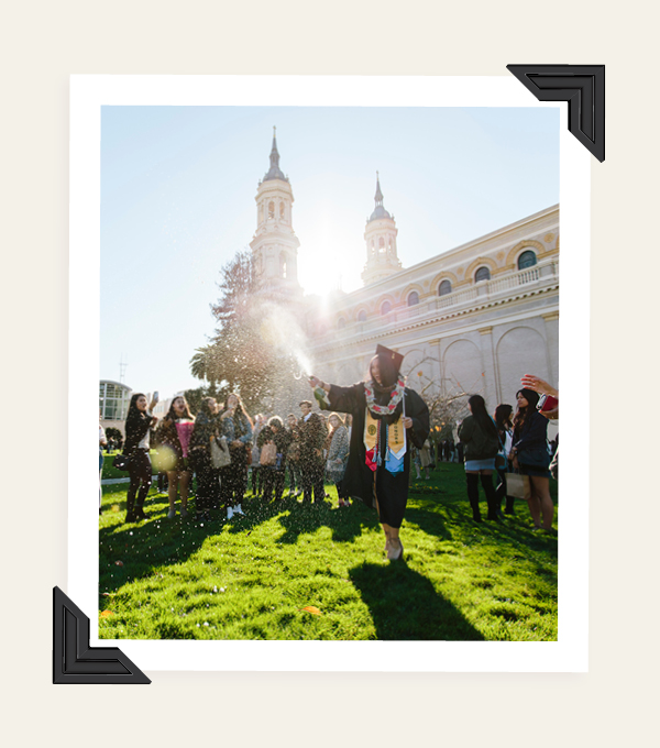 students celebrating there graduation outside st. Ignatius