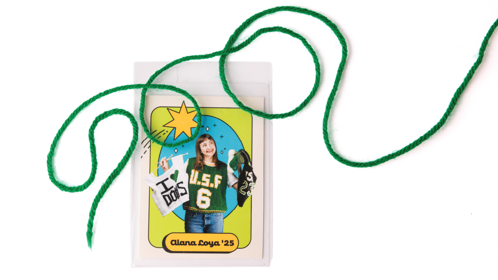 Alana Loya holding up hand-knit items