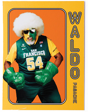 Waldo Pasache in large wig, green Hulk gloves, and a Dons jersey