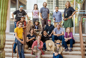Frances Reyes-Bolinger ’09 and crew posing for a group photo on set