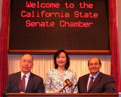 USF School of Management professors Xiaohua Yang and Stanley Kwong speak at the California Senate Chamber