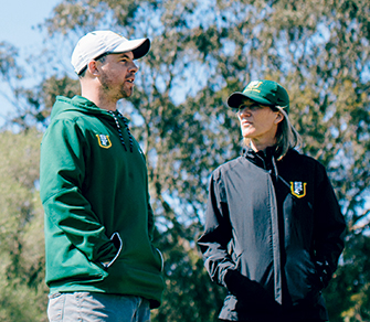 Assistant Coach Benji Wetli talks to Coach Helen Lehman-Winters