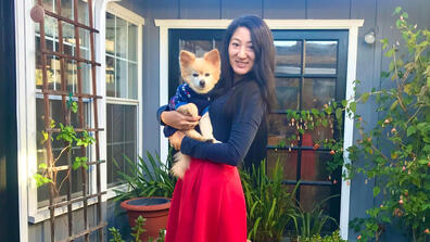 Lily Yuan holding a puppy