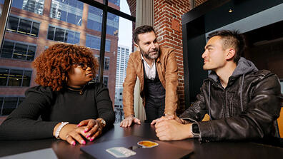 Three USF students having a chat in USF's downtown campus