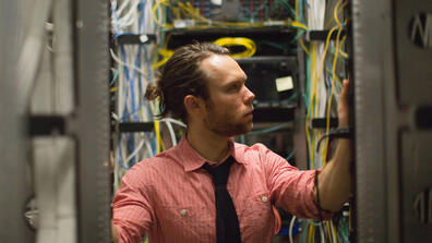 man working in server room