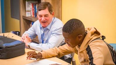 Jeff Silk talking with a student