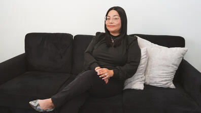 Stephanie Estrada sitting on a couch