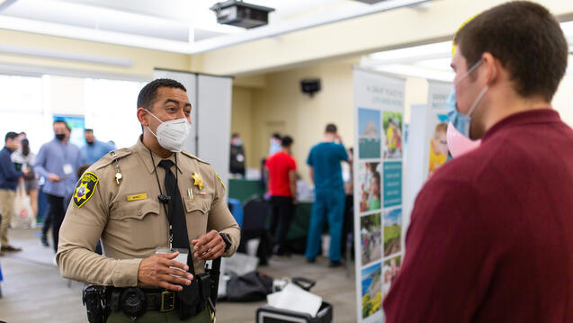 Police officer talking to student
