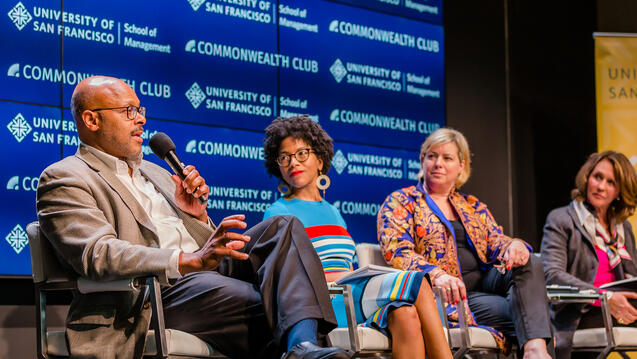 Speakers talking during a conference