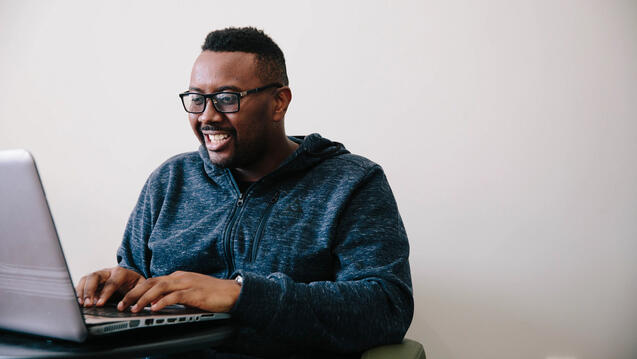 student using laptop computer