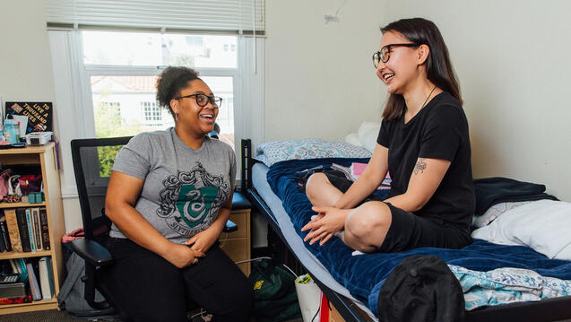 Two students chatting in residence hall