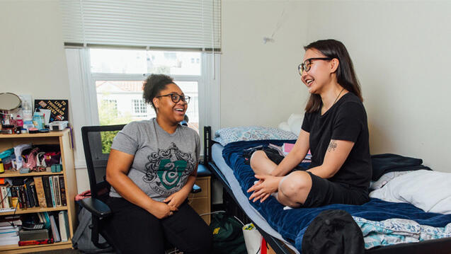 Two students chatting in residence hall