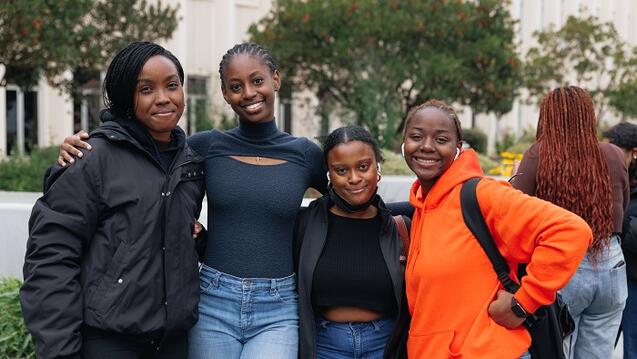 group of students smiling together at an event