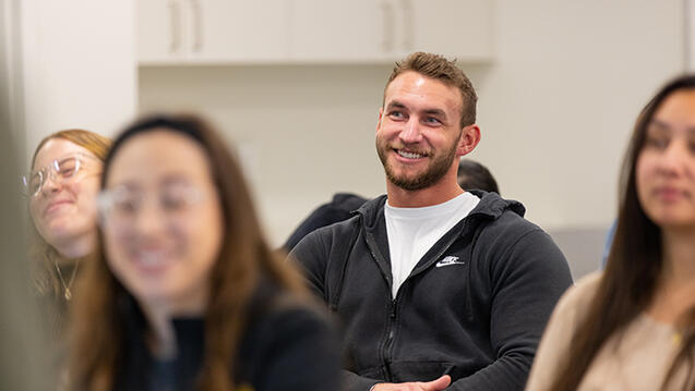 student smiling in classroom