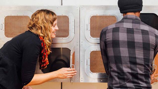 Two people looking at an exhibit.