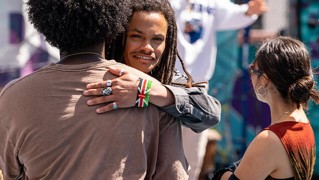 usf student hugging someone outside