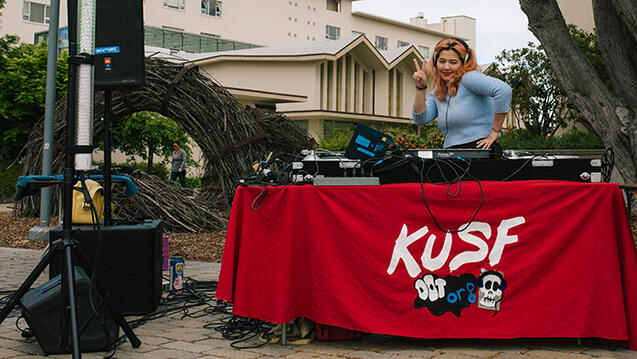 student broadcasts music outside on usf campus