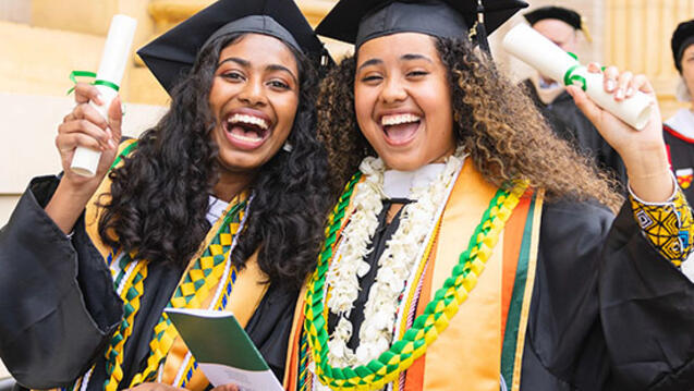 Two students in caps and gowns