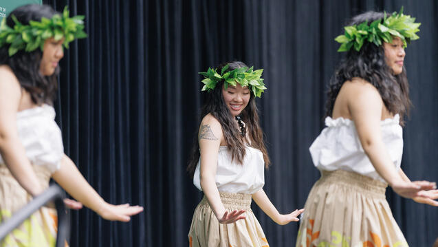 students perform a dance on stage