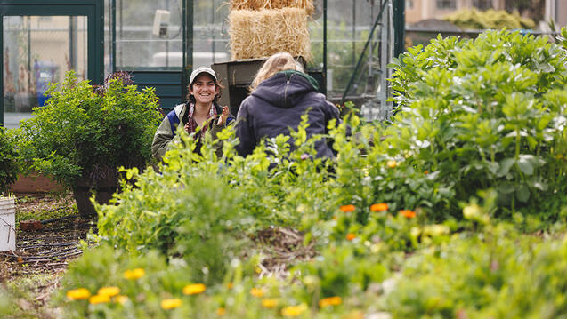 Smiling student in garden.