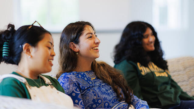 students sitting on couch together