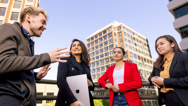 graduate students talking outside