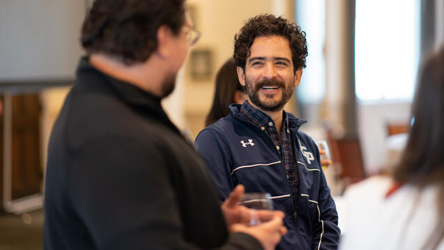 two people talking to each other during an event