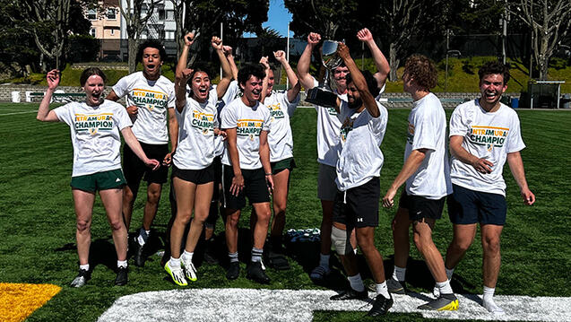 students jump into the air on a sports field