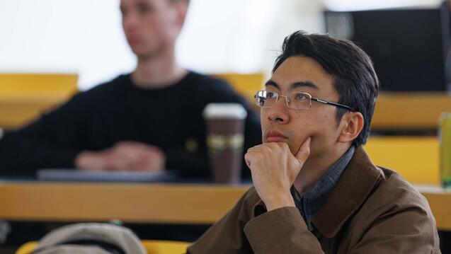 Student sitting and listening during lecture