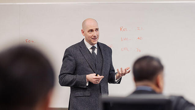 professor speaks in front of class