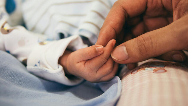 Baby's tiny hand