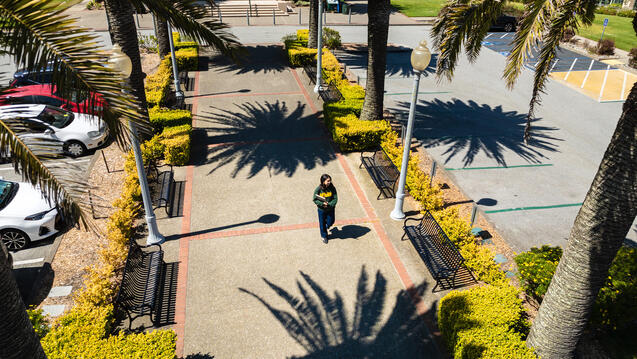 student walking on campus