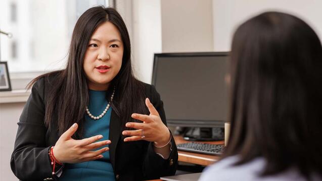 women advising a student