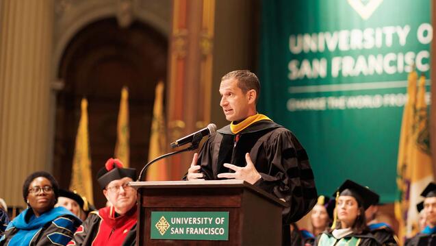 Daniel Lurie giving the commencement address