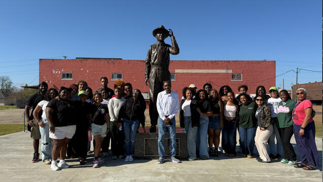Group of students In front of the Emmett Till statue in Mississippi