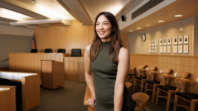 law student smiles in courtroom