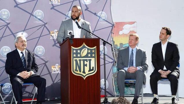 Trimiew giving a speech at an NFL podium