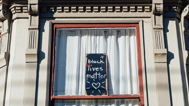 Black Lives Matter sign in a window