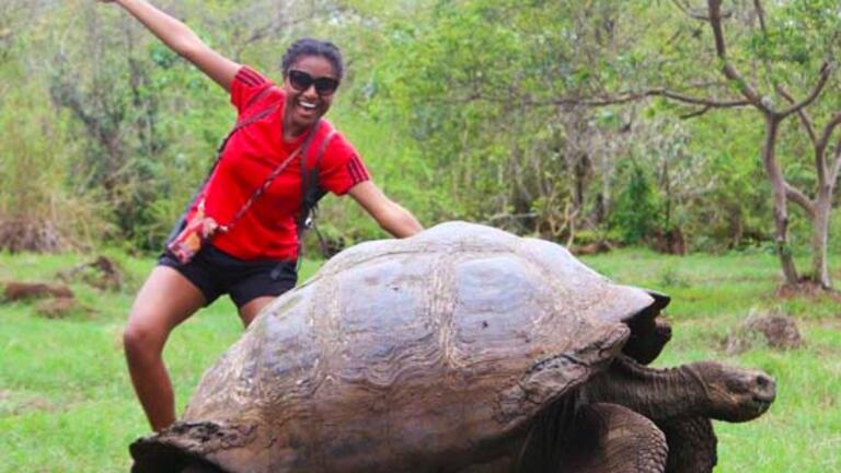 Germaine Kabutaulaka ‘17 on the back of a giant tortuous 