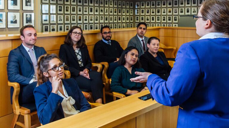 Student presents to a jury in moot court.